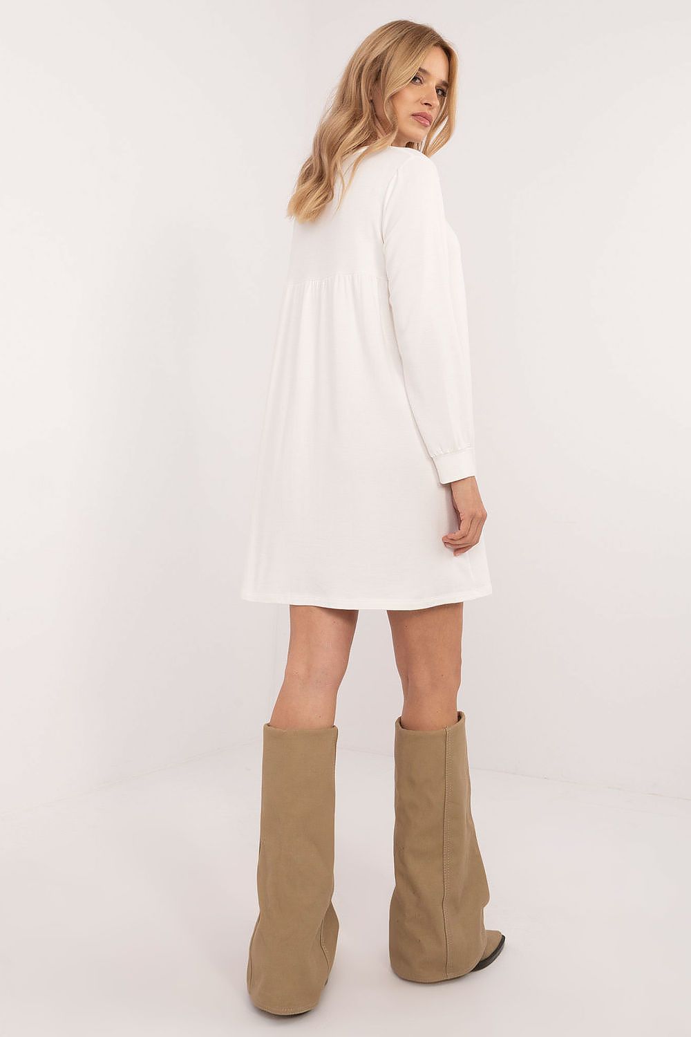 Relevance casual oversized mini dress in white with long sleeves worn with beige boots
