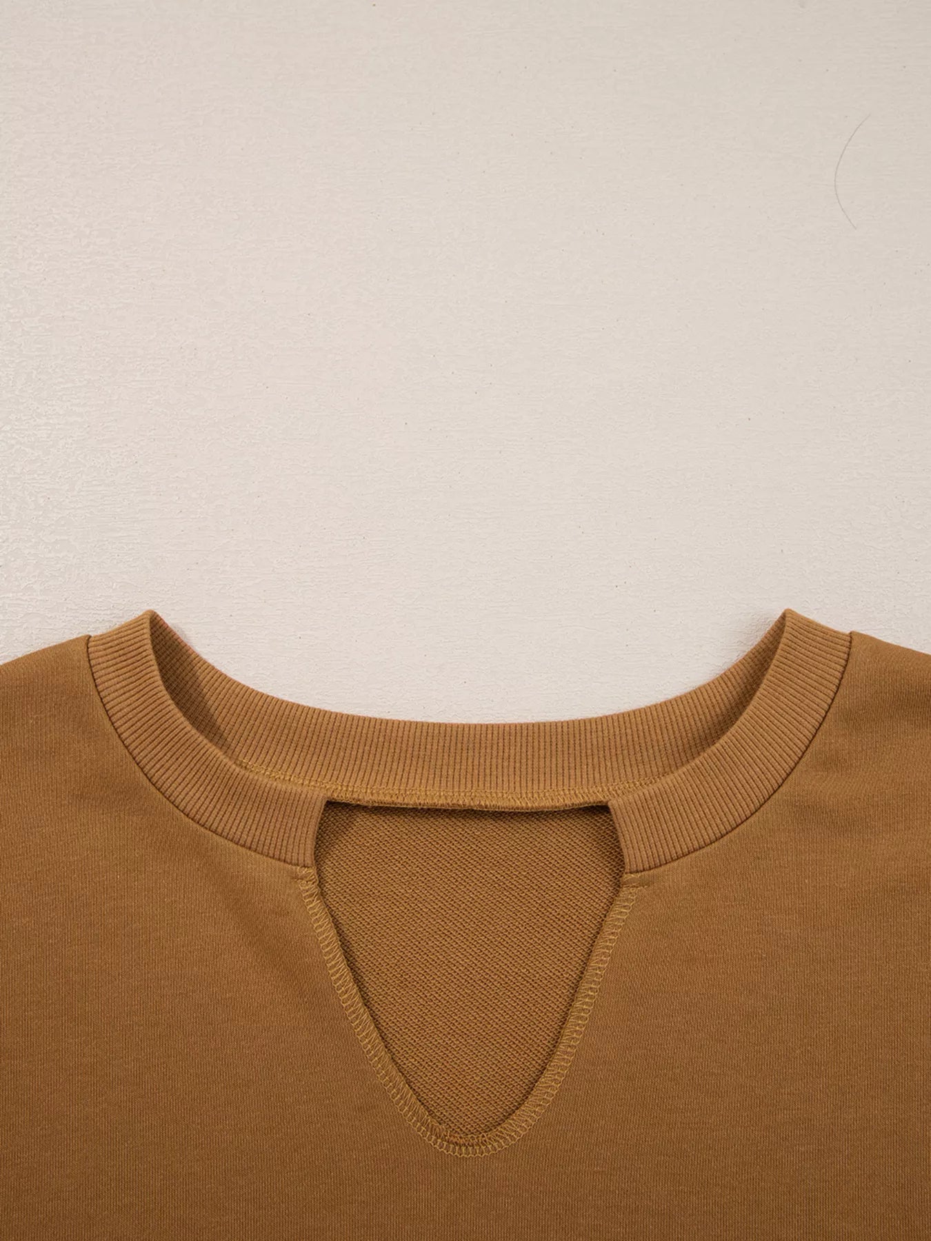 Oversized Textured Split Neck High Low Sweatshirt in a warm brown colour with a unique neckline design