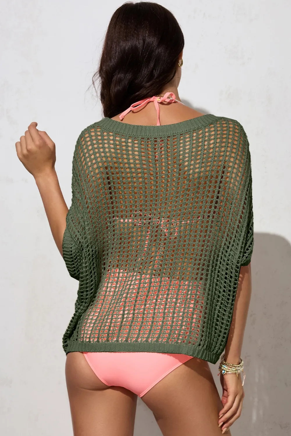 Green camisola knit beach cover up worn over pink bikini showing back view