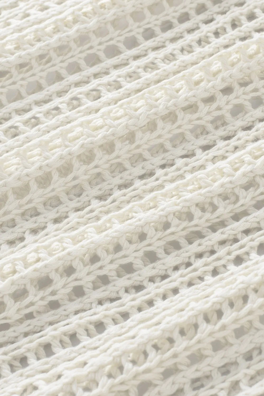 Close-up of white knit fabric texture for Trendsi knit beach cover up camisola