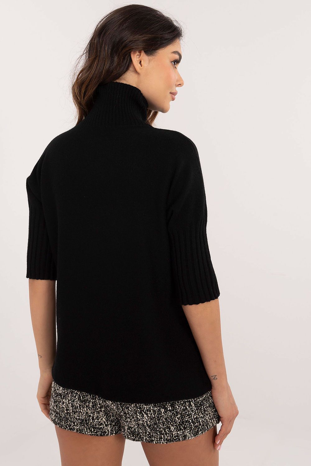 BFG black short sleeve turtle neck sweater with ribbed sleeves on female model