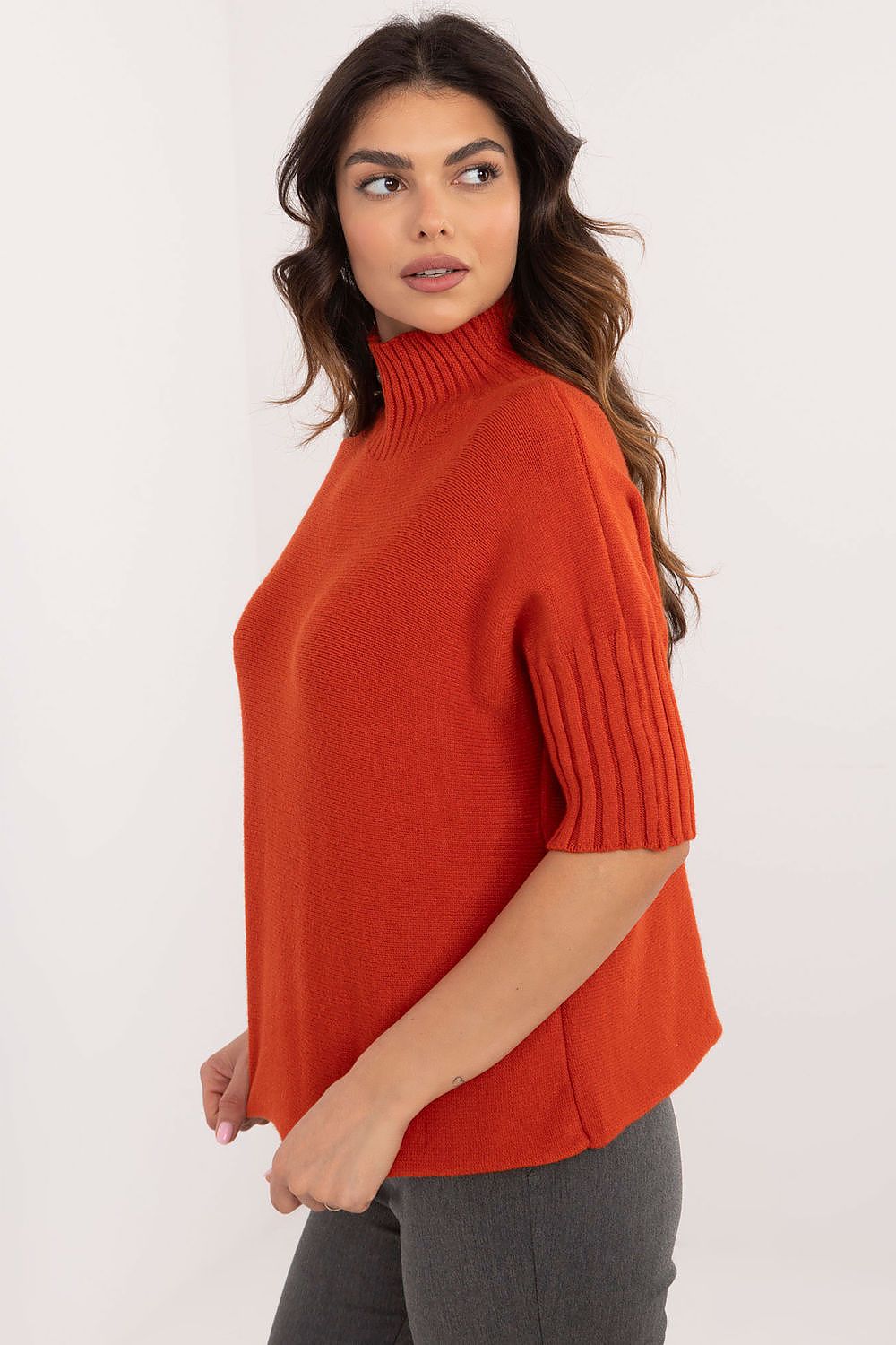 BFG orange short sleeve turtle neck sweater with ribbed sleeves on female model