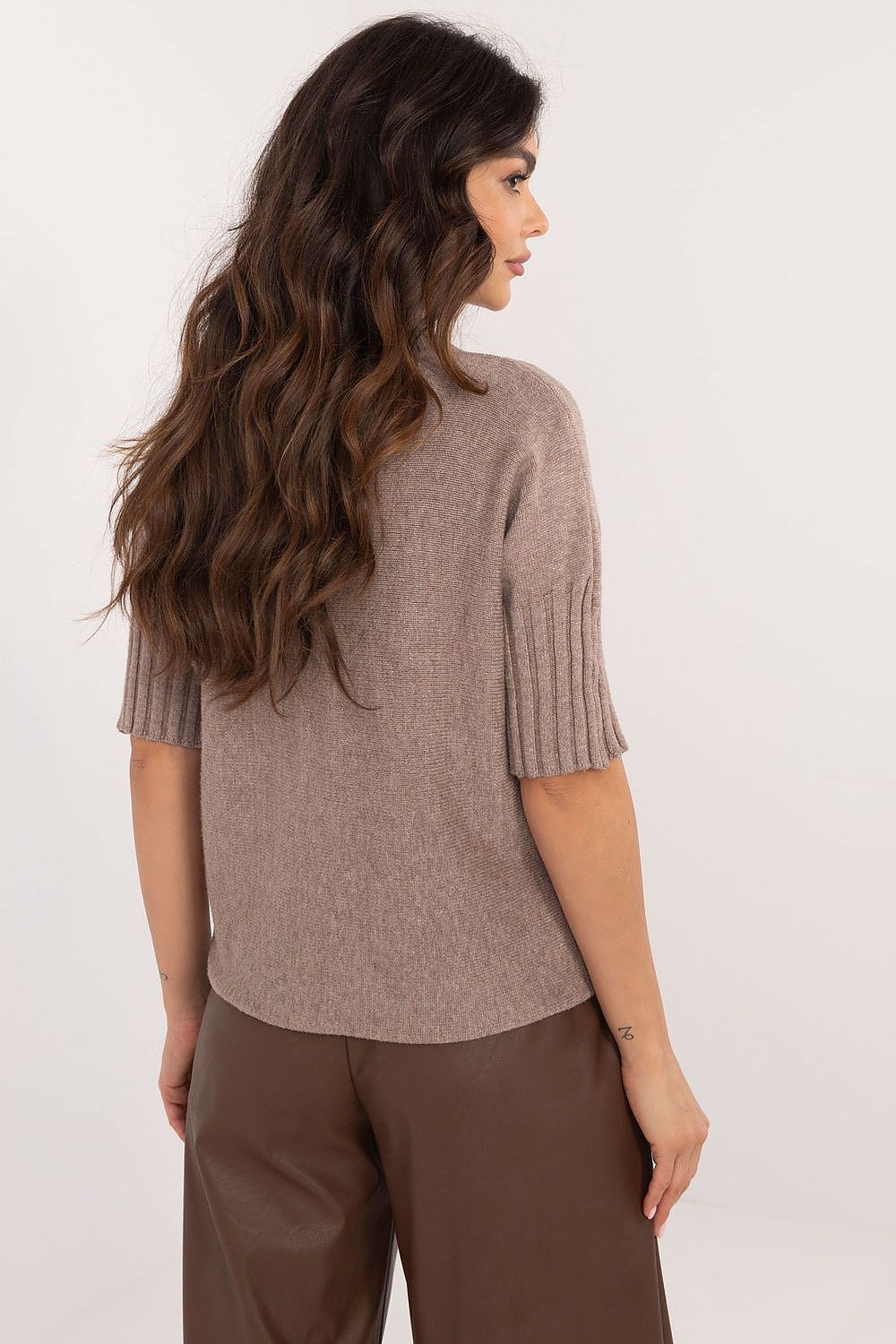 BFG short sleeve turtle neck sweater in brown knitted fabric worn by woman shown from back