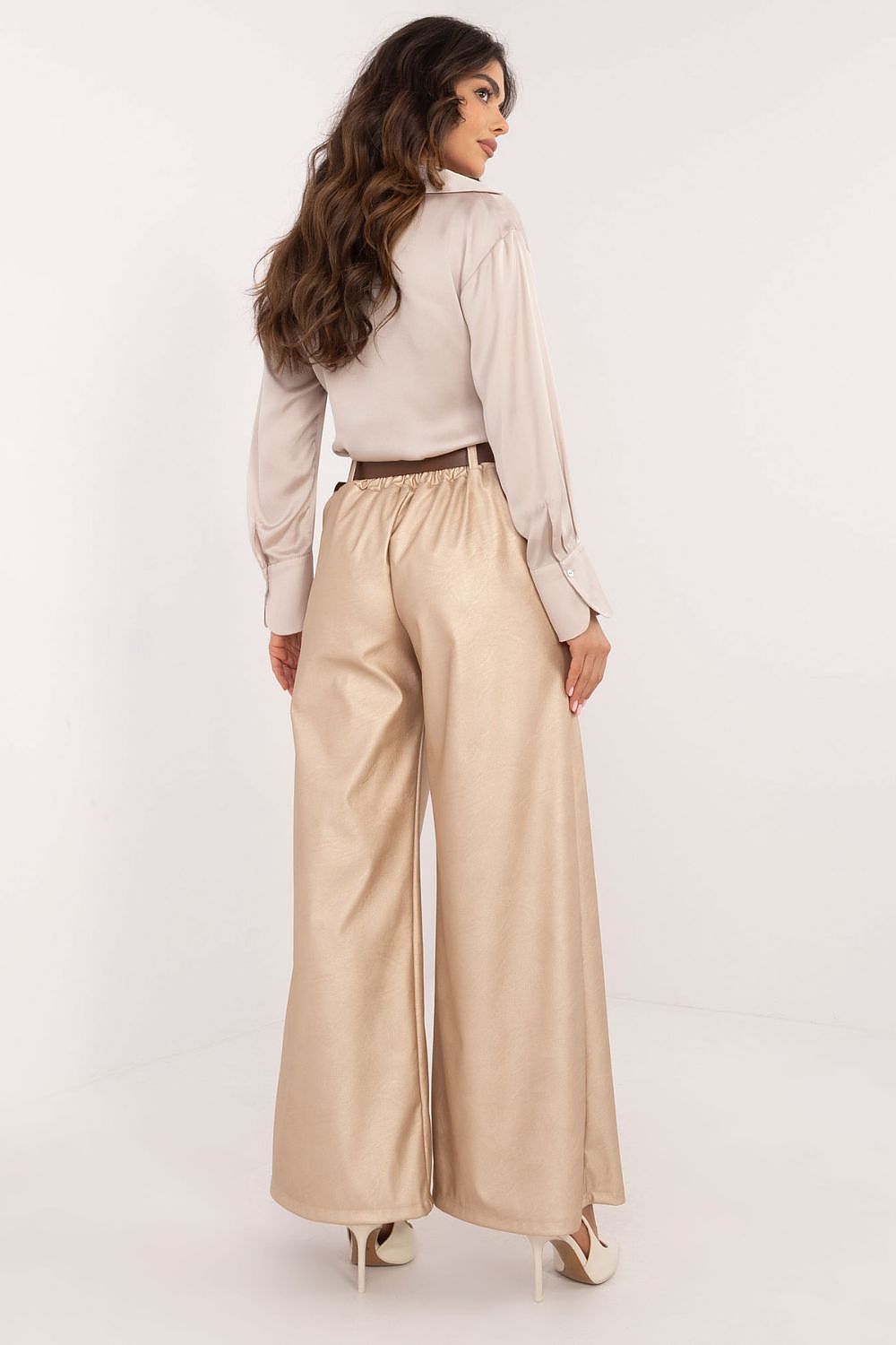 Italy Moda beige wide leg faux leather trousers worn by a model with a tucked-in blouse and heels