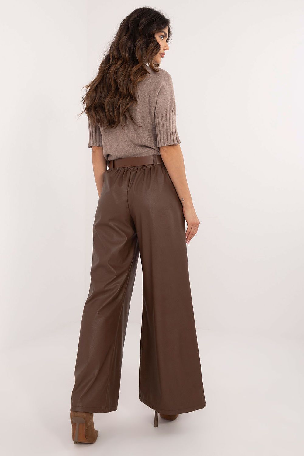 Italy Moda wide leg faux leather trousers in brown worn by model with taupe knit top and heels