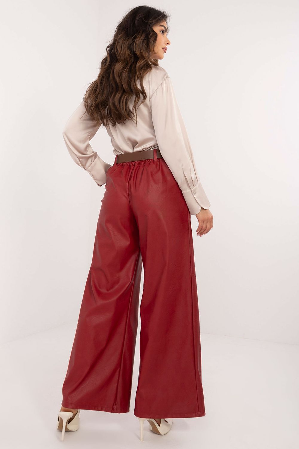 Italy Moda wide leg faux leather trousers in deep red worn by model with beige blouse and heels
