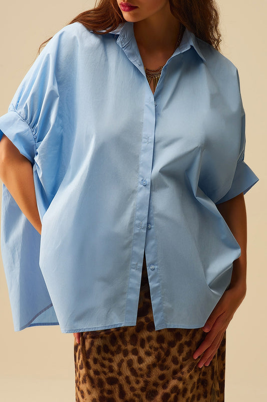 Q2 Blusa azul-bebé de grandes dimensões com manga curta