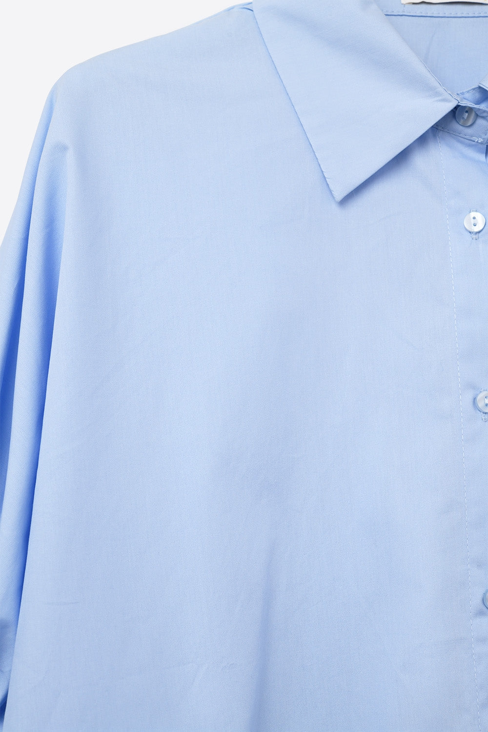 Blusa azul-bebé de grandes dimensões com manga curta