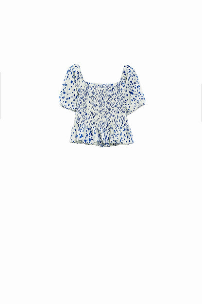 Blusa branca com peplum e bolinhas azuis