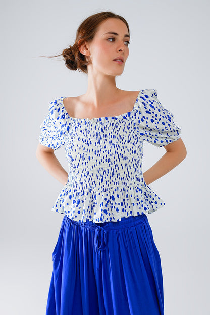 Blusa branca com peplum e bolinhas azuis