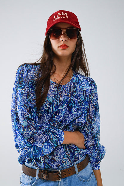 Blusa com estampado abstrato e mangas em balão em azul