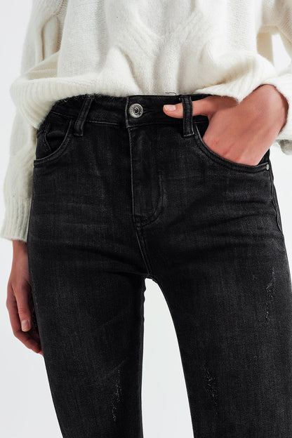 Calças de ganga skinny de lavagem preta e fecho nas bainhas