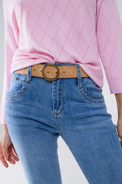 Calças de ganga skinny em lavagem clara com pormenor no bolso