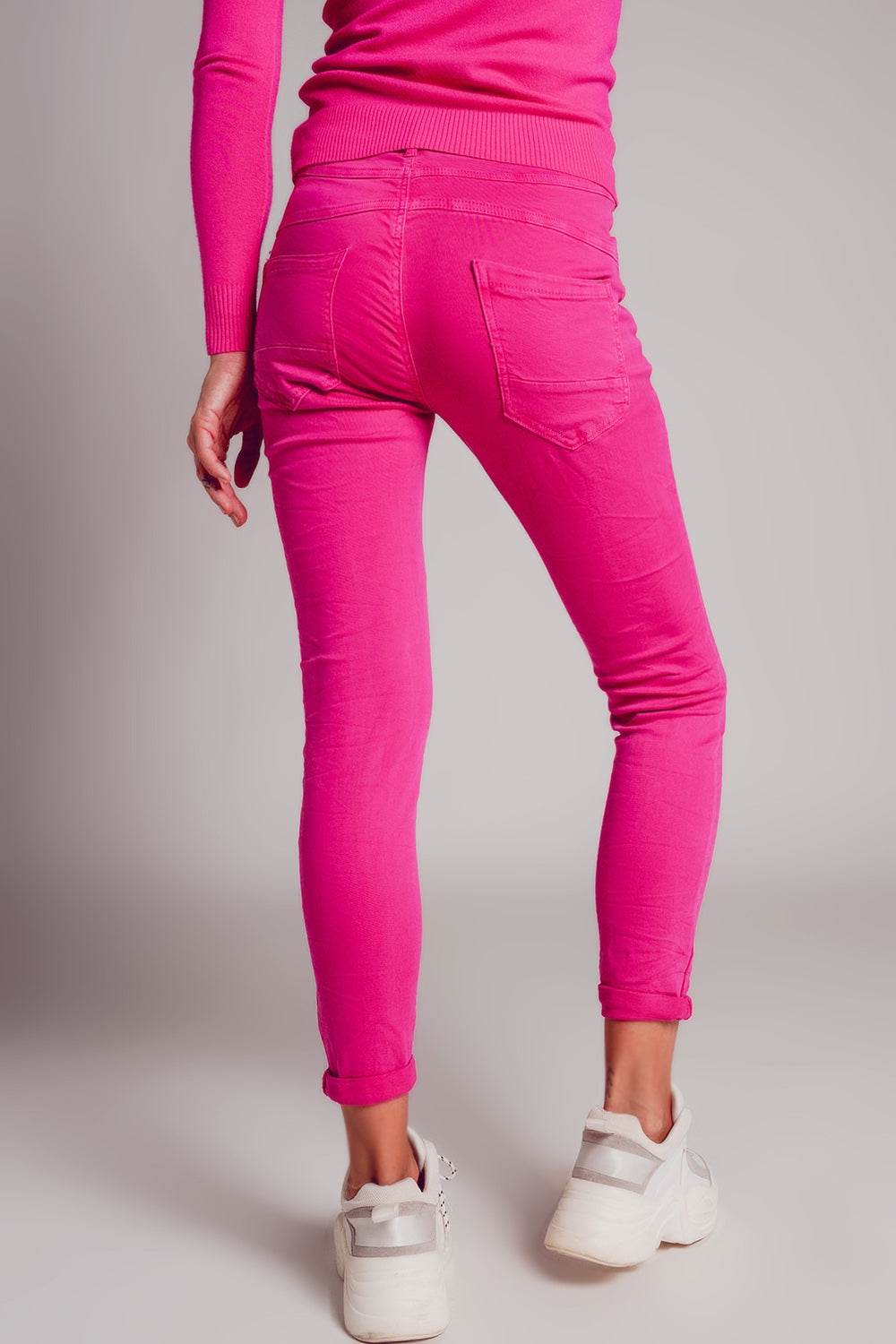 Calças de ganga skinny fuchsia com fecho de botão exposto
