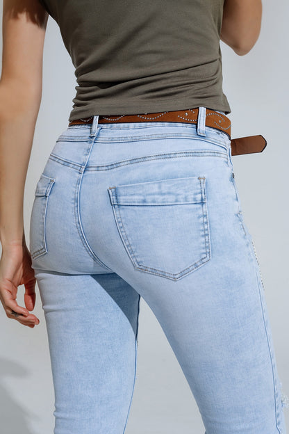 Calças de ganga super skinny azuis claras com laços e buracos rasgados