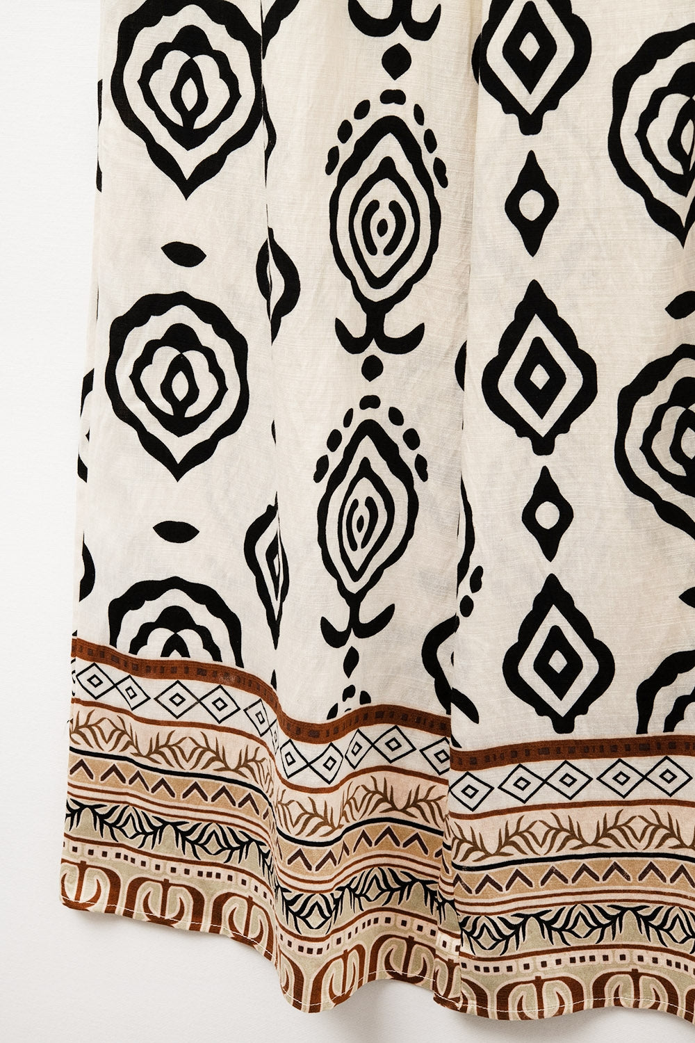 Calças largas creme com estampa boho
