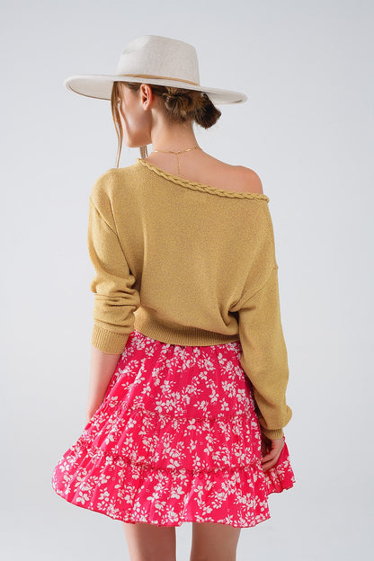 Camisola leve com decotes em V largo e detalhes entrançados em dourado