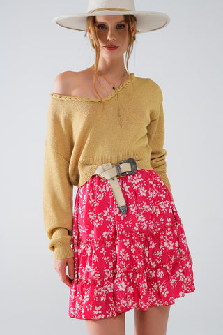Camisola leve com decotes em V largo e detalhes entrançados em dourado