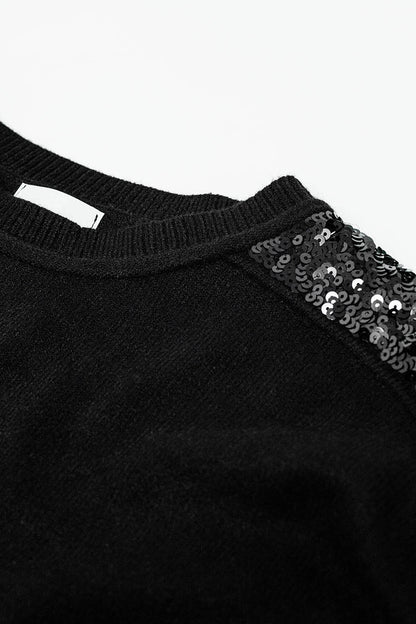 Camisola preta de mangas compridas com lantejoulas nos ombros