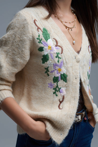 Casaco de malha bege com flores bordadas