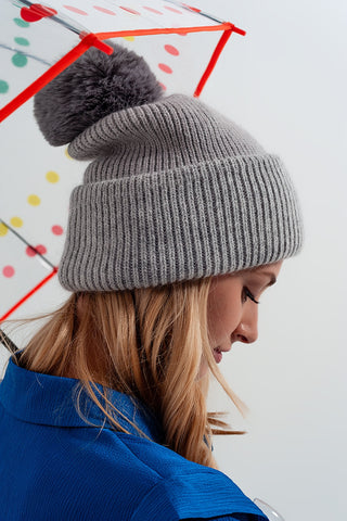 Gray knitted hat with pompom