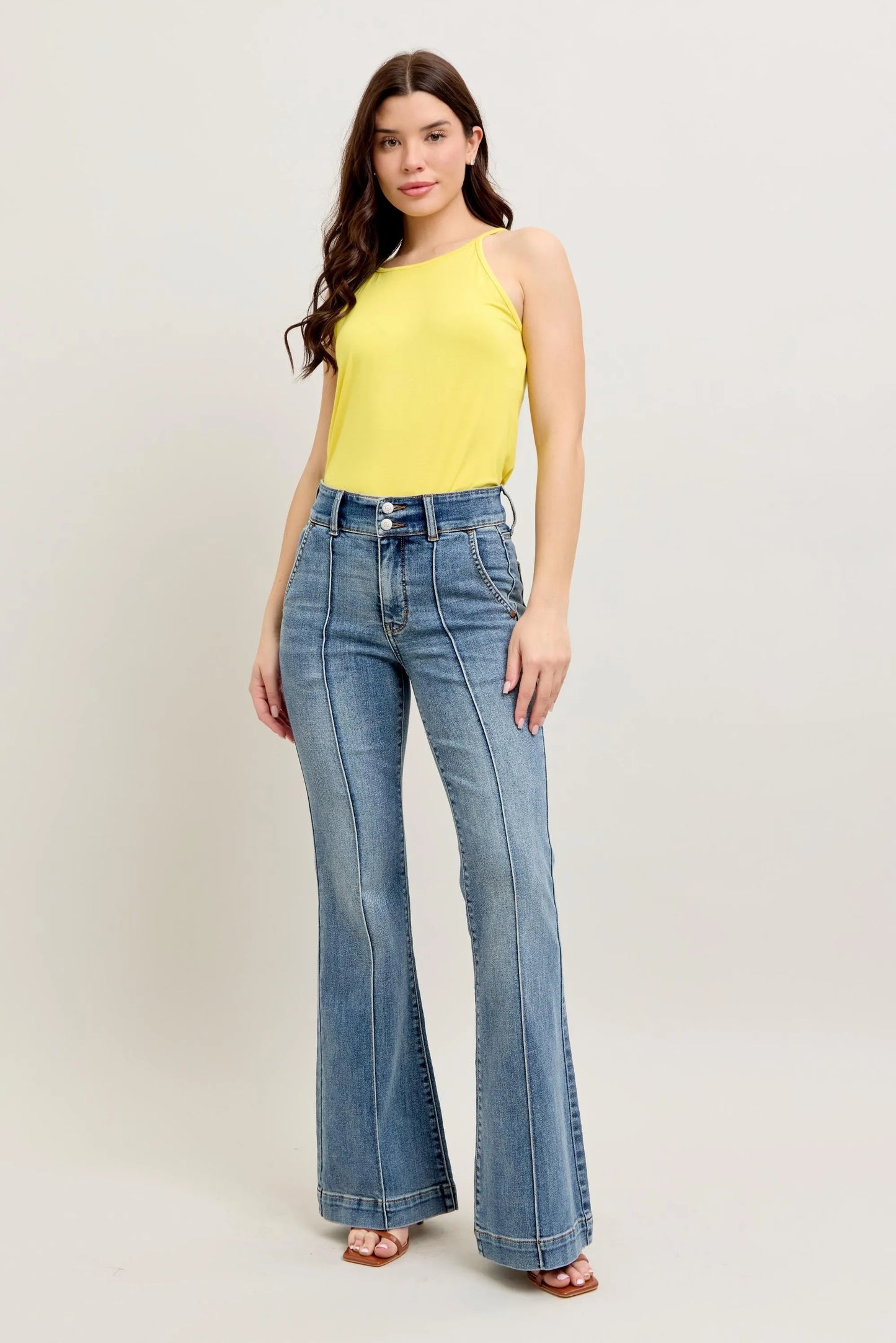 Woman wearing Judy Blue front seam denim pants with high waist and flare leg style