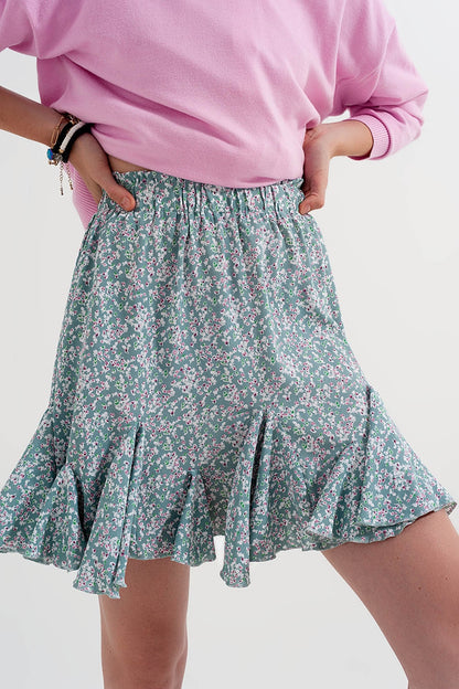 Mini-saia verde com estampas florais e rufos