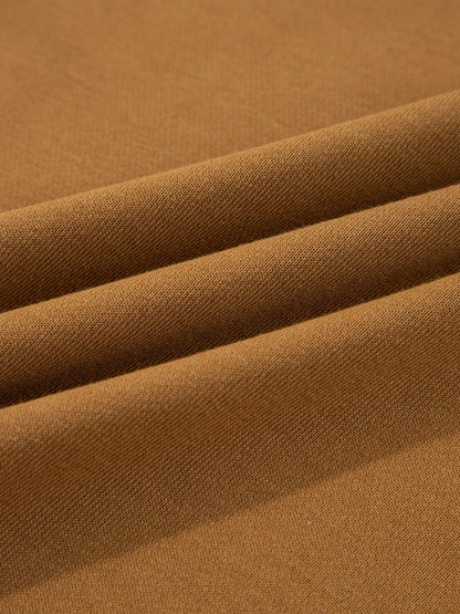 Close-up of the fabric texture of an Oversized Textured Split Neck High Low Sweatshirt in rich brown colour