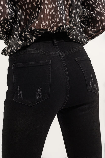 Calça jeans skinny com bainha crua em preto lavado