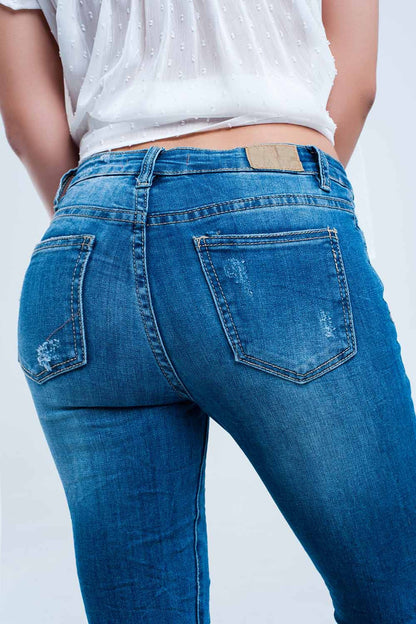 Jeans skinny elástico com rasgos