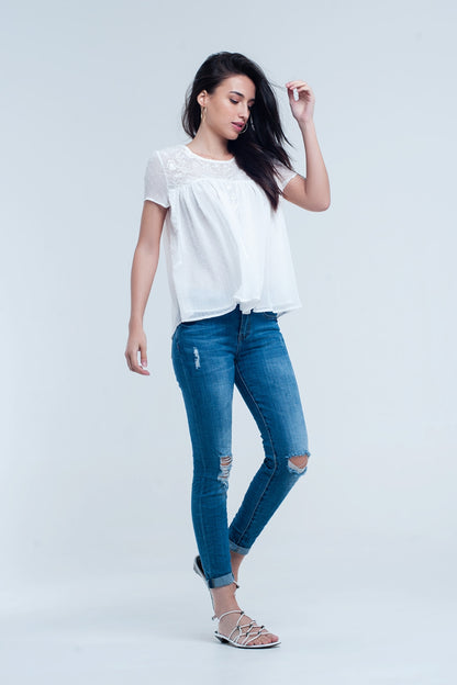 Jeans skinny elástico com rasgos