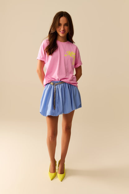 Camiseta cor-de-rosa com impressão do logótipo de Miami em amarelo