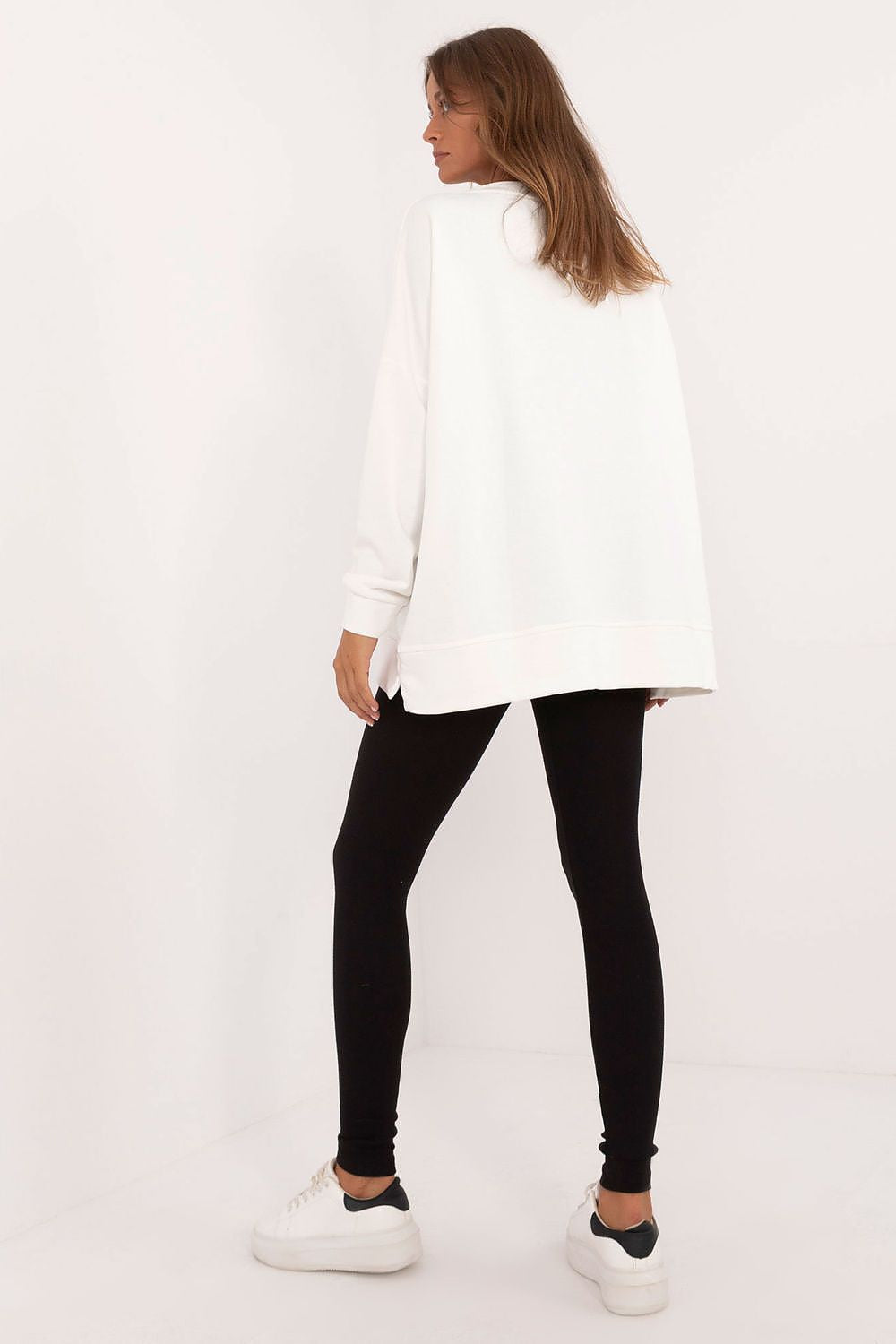 Factory Price oversized sweatshirt and leggings set in white and black worn by woman standing