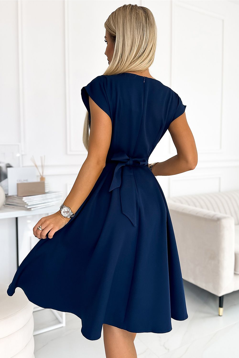 Vibrant formal dress for women in navy blue with short sleeves and waist tie